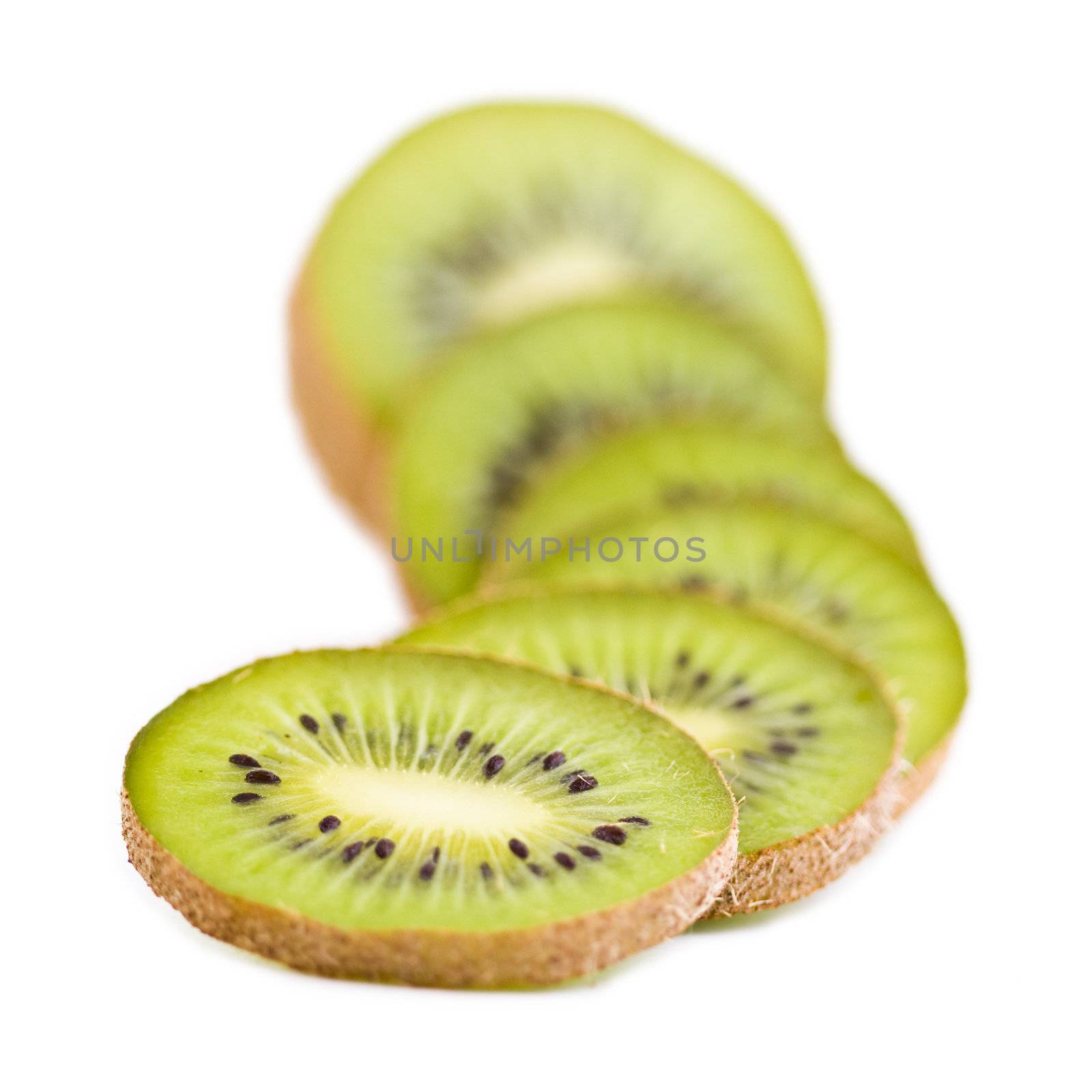 A few brown fresh kiwi fruits slices