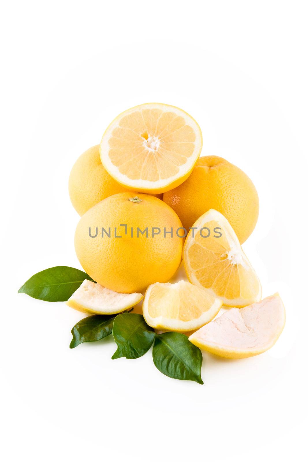 Juicy white grapefruits in stack isolated on white background