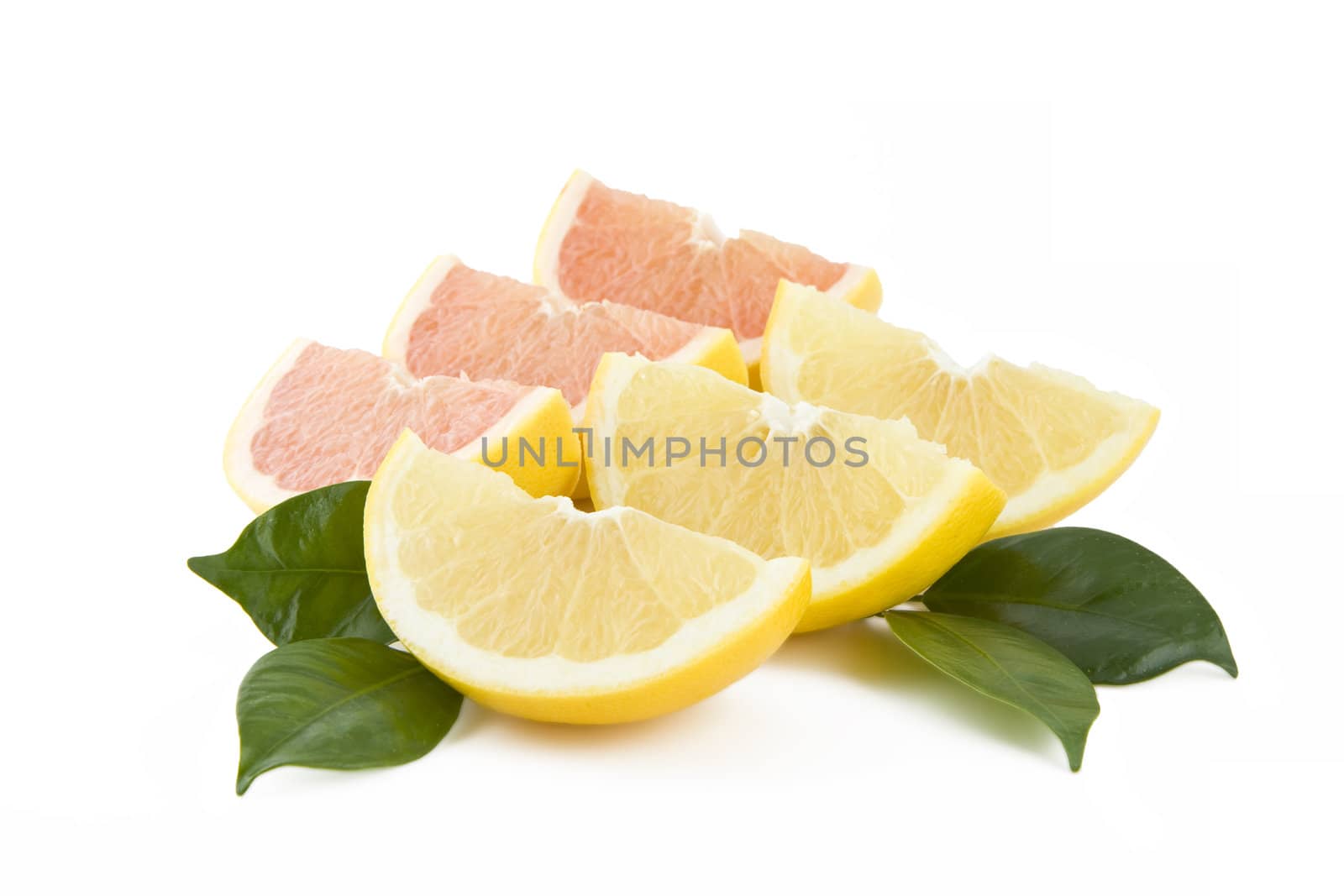 Juicy white and red grapefruits parts isolated on white