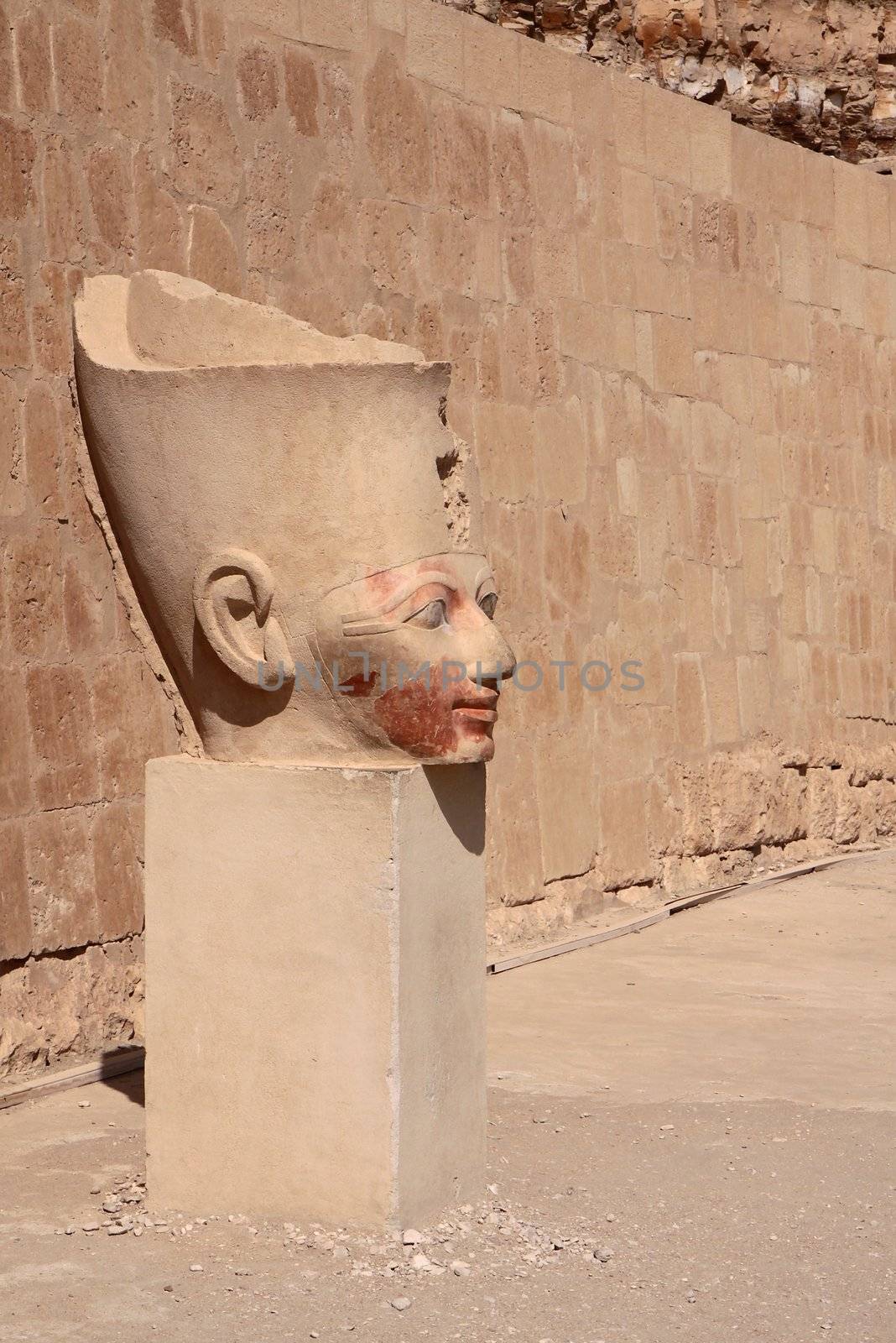 The ancient stone pharaoh's head in Egyptian temple
