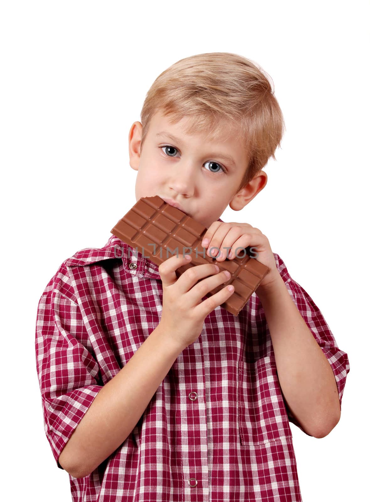 boy eat chocolate on white by goce