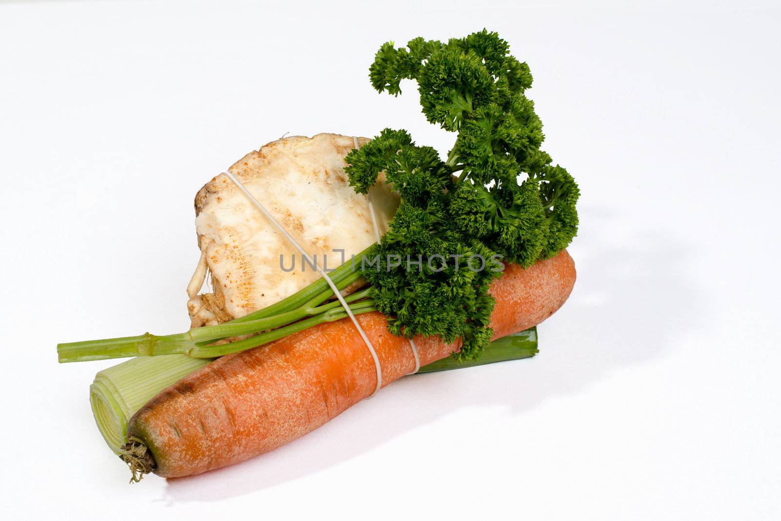 Mirepoix - standard fresh herbs and roots for soup isolated on white background