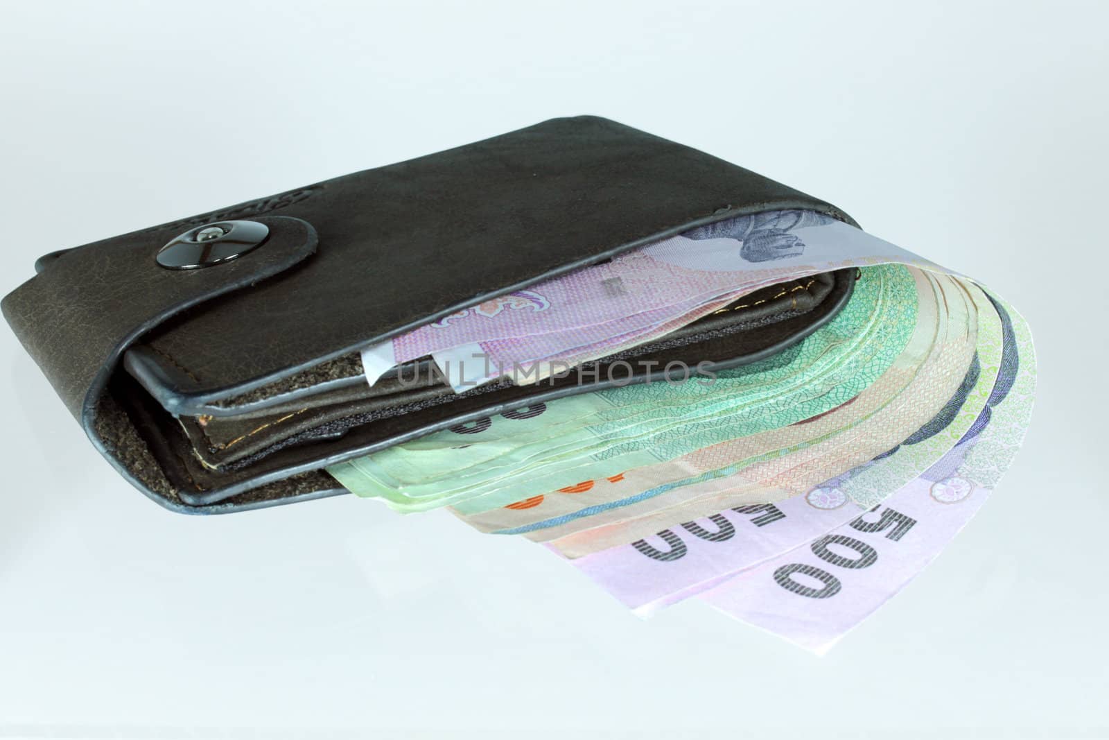 Thai banknote in wallet on white background