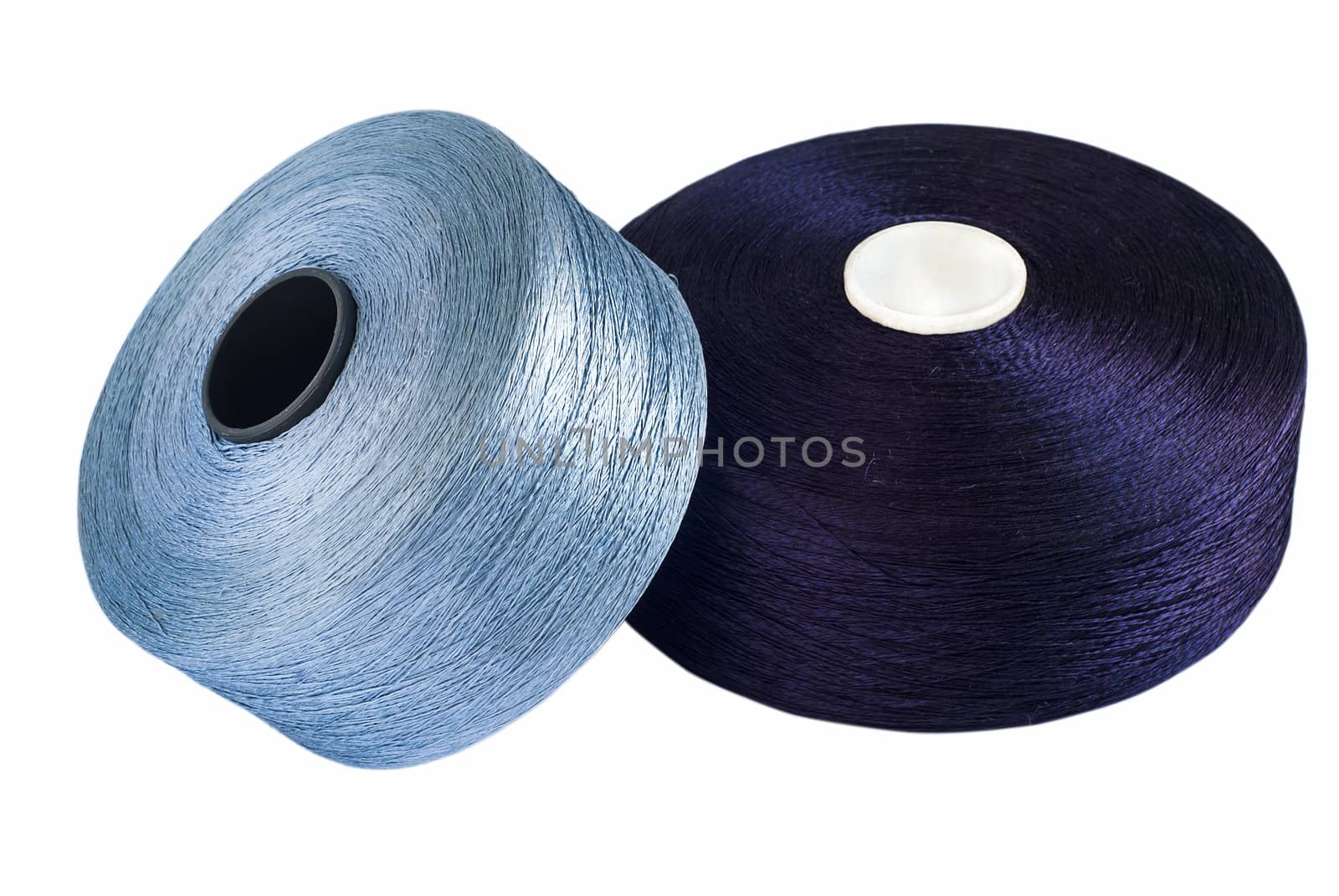 Blue silk yarn rolled on coils isolated on white background
