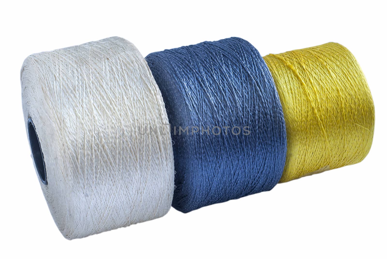 Colored silk yarn rolled on coils isolated on white background