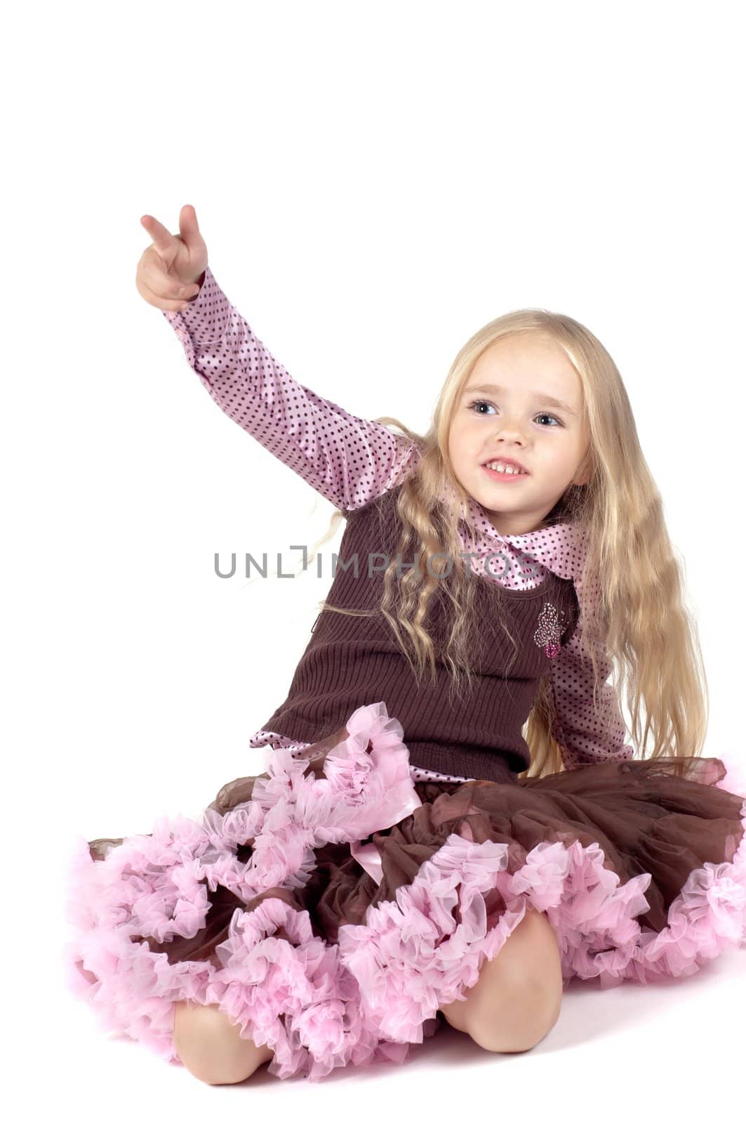Shot of little girl Little girl in brown and pink clothes in studio