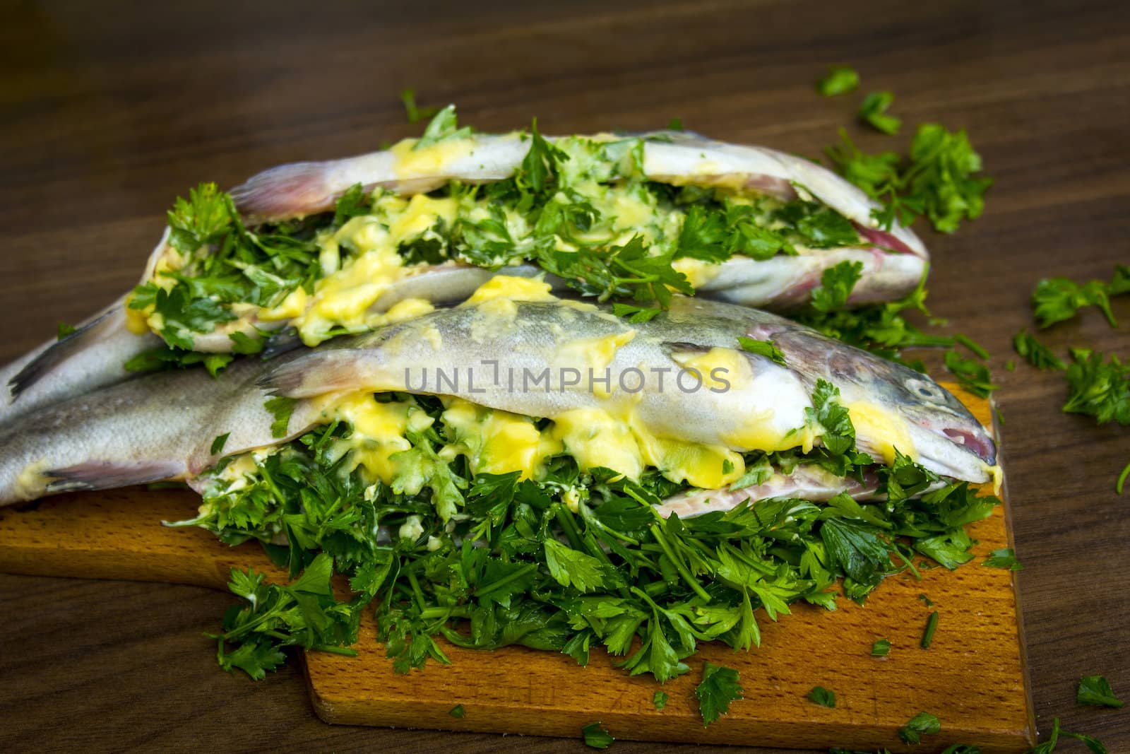 Two raw trouts on the kitchen table, ready to cook