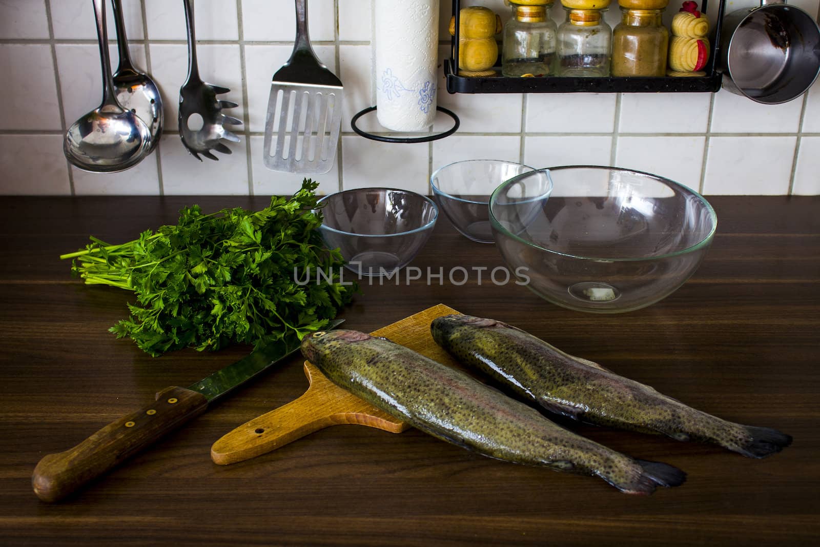 Two raw trouts on the kitchen table, ready to cook