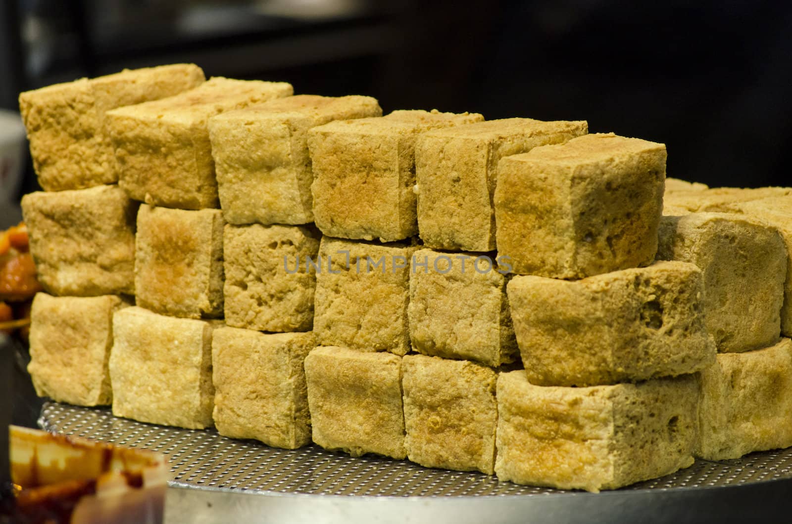 smelly deep fried toufu piled up in stack 