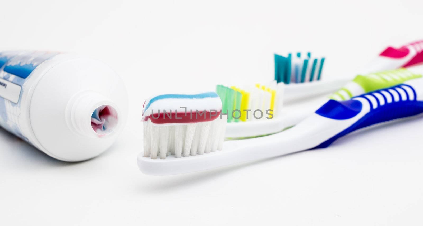 Tooth brush with tooth paste on white background