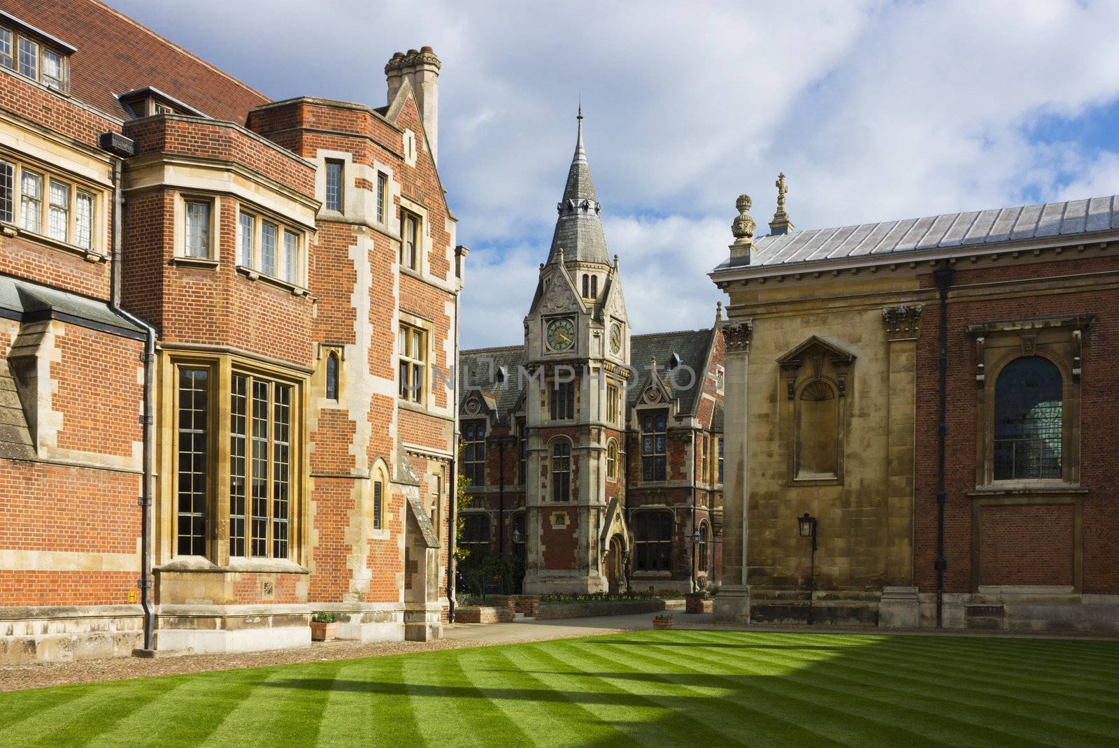 View of Pembroke College in Cambridge, United Kingdom in a bright sunny day with white clouds on the blue sky.