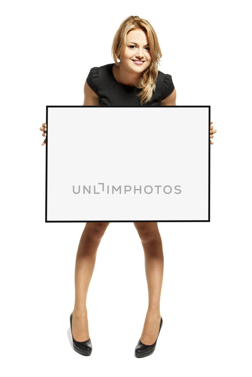 Attractive young woman holding up a poster. Isolated on white background.