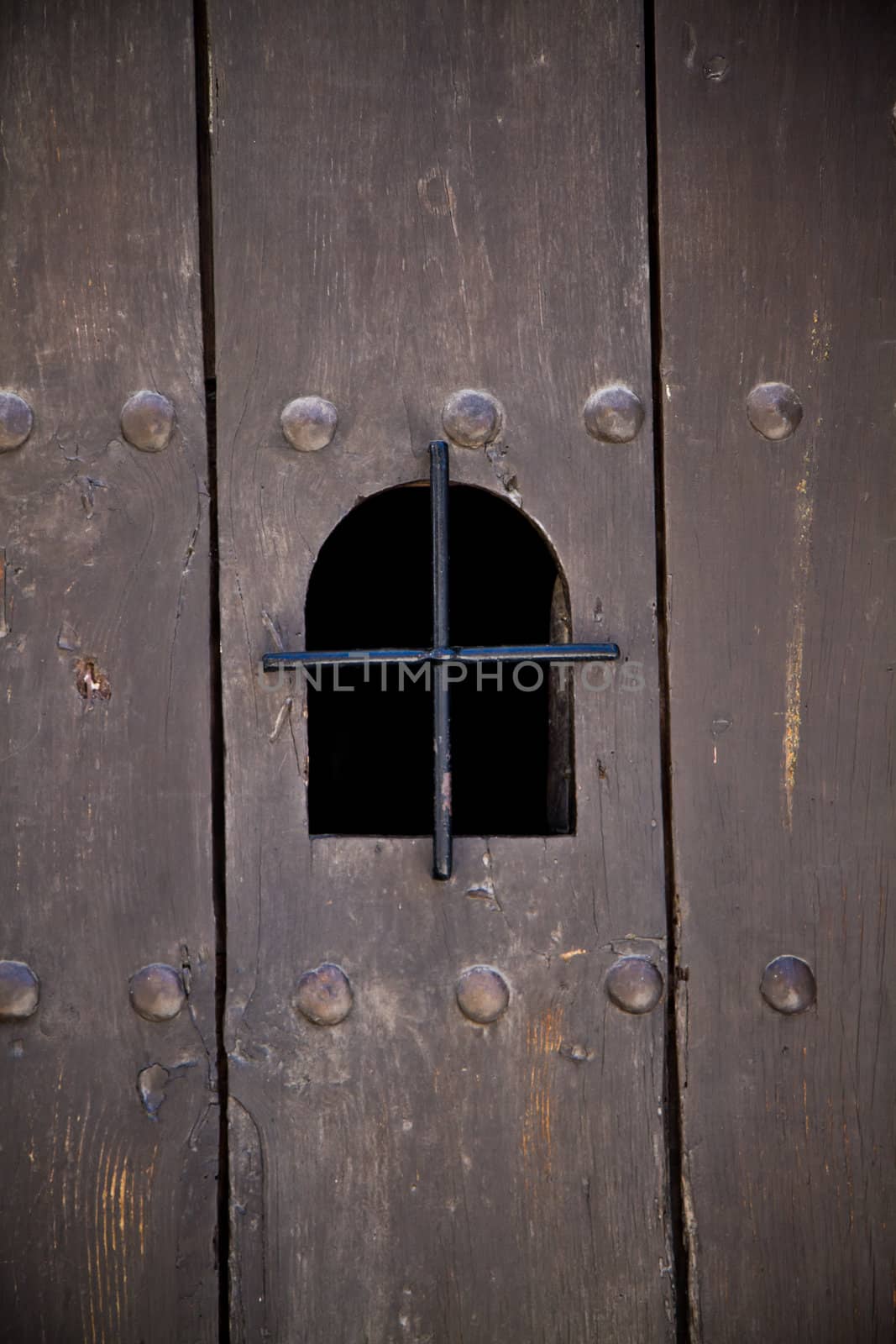 Viewing portal in an ancient european door.