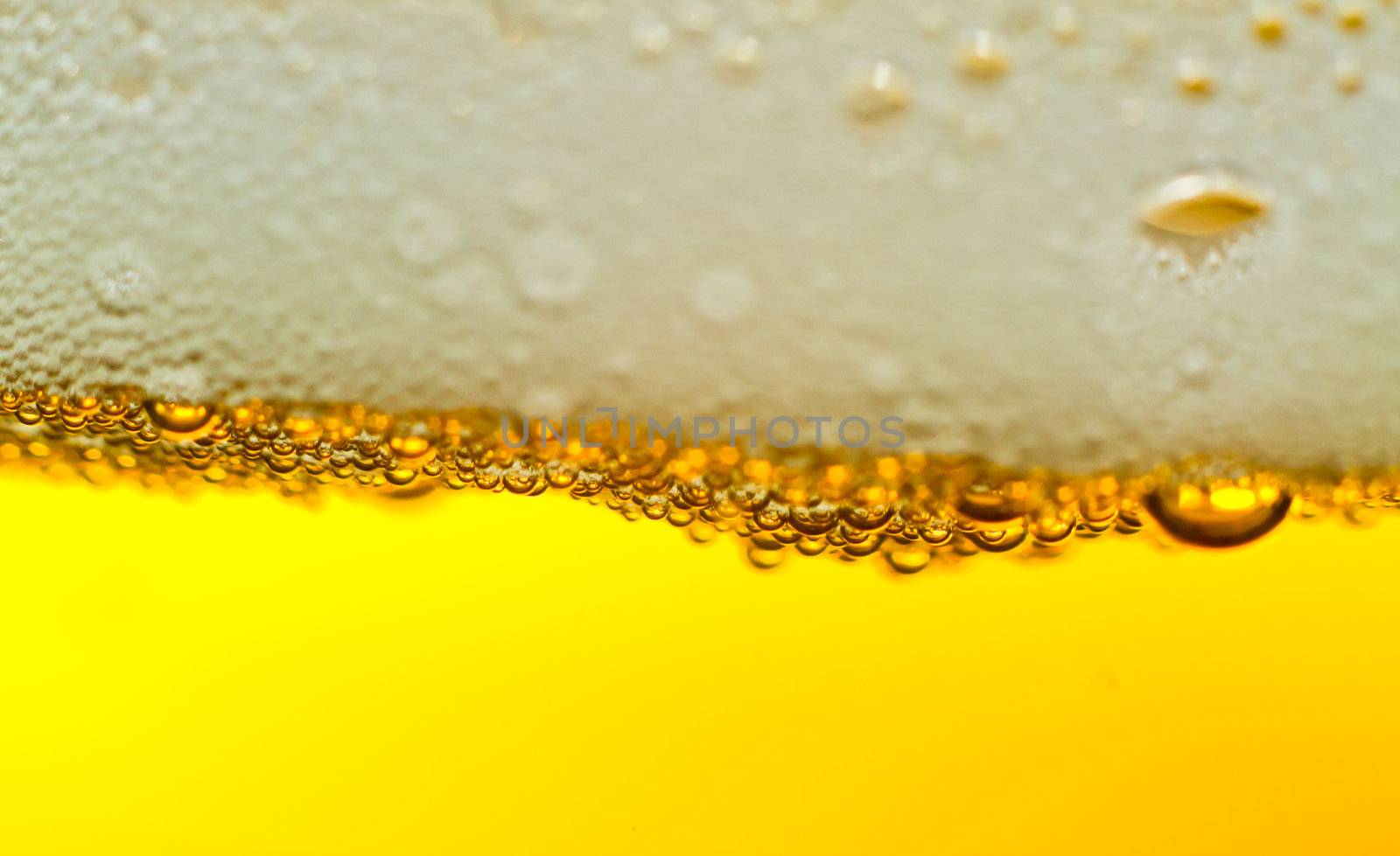Super close up of the bubbles in beer with plenty of copy space.