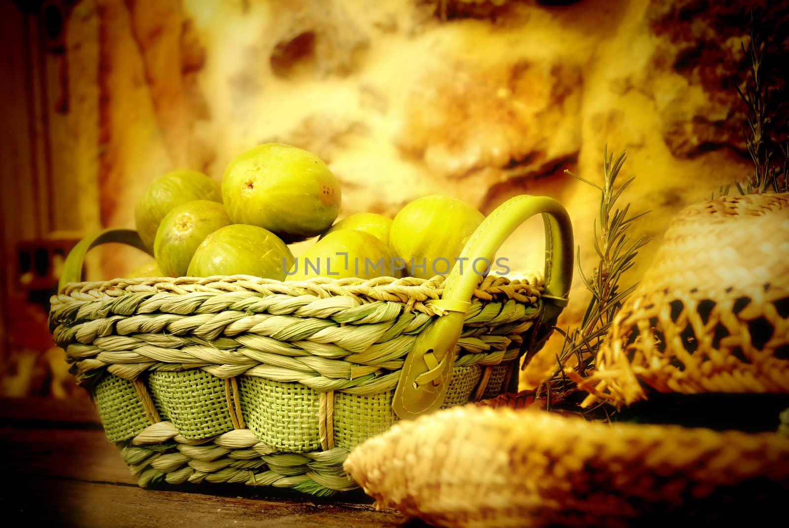 basket of figs and straw hat, country scene