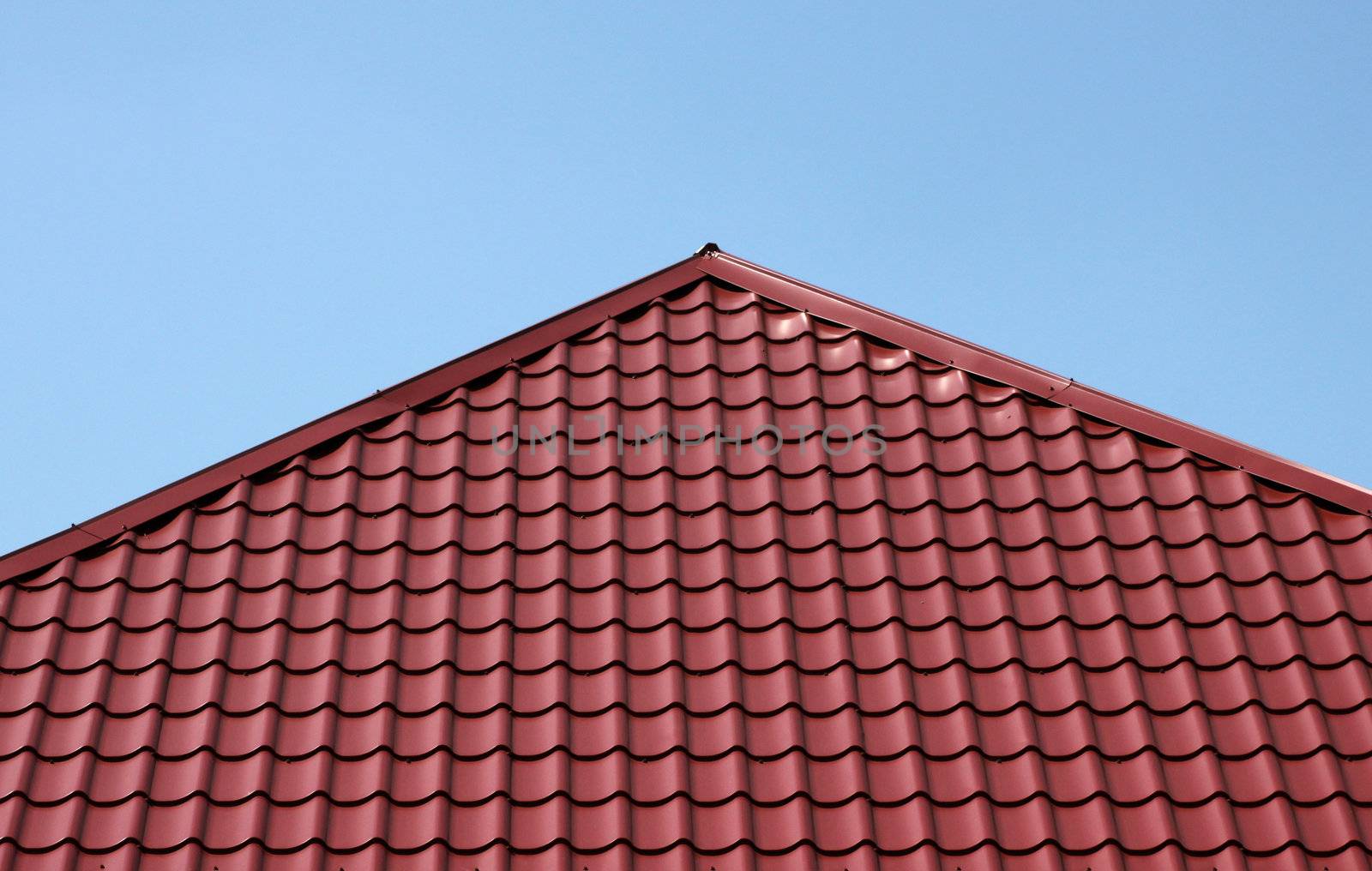 red tiled roof over blue sky