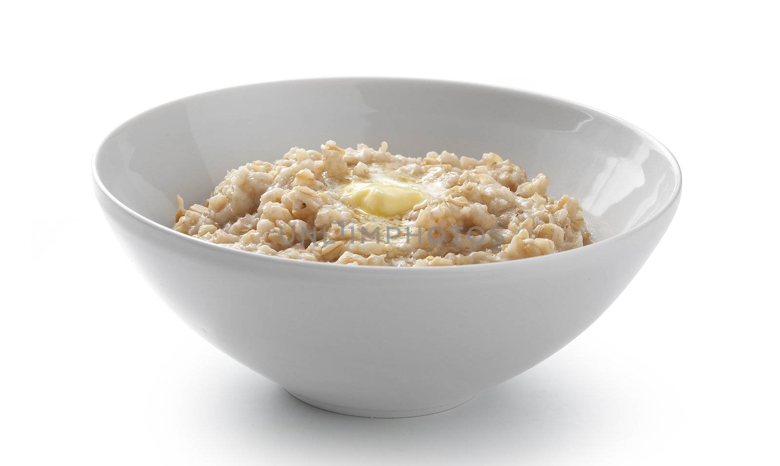 Isolated white bowl with fresh porridge on the white