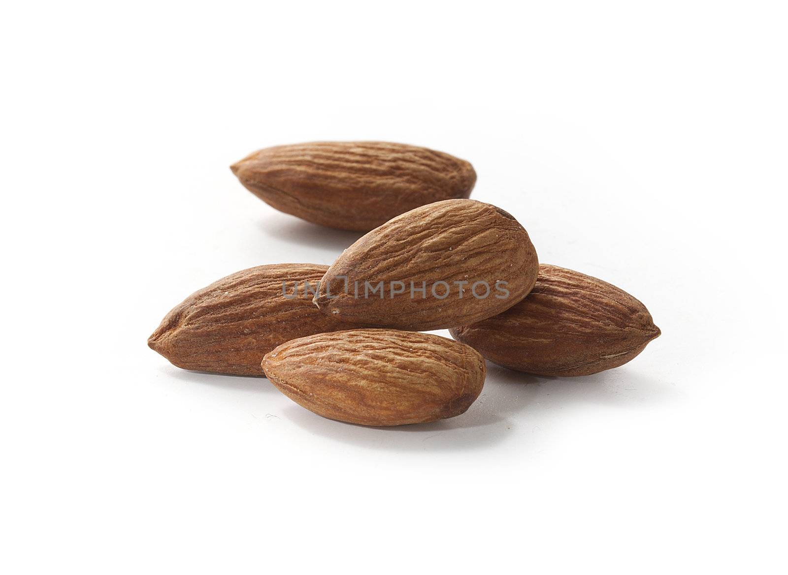 Handful of almond on the white background