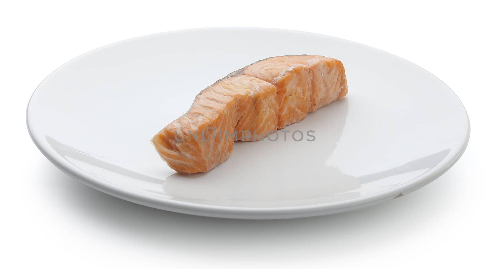 Piece of steamed salmon's fillet on the white plate