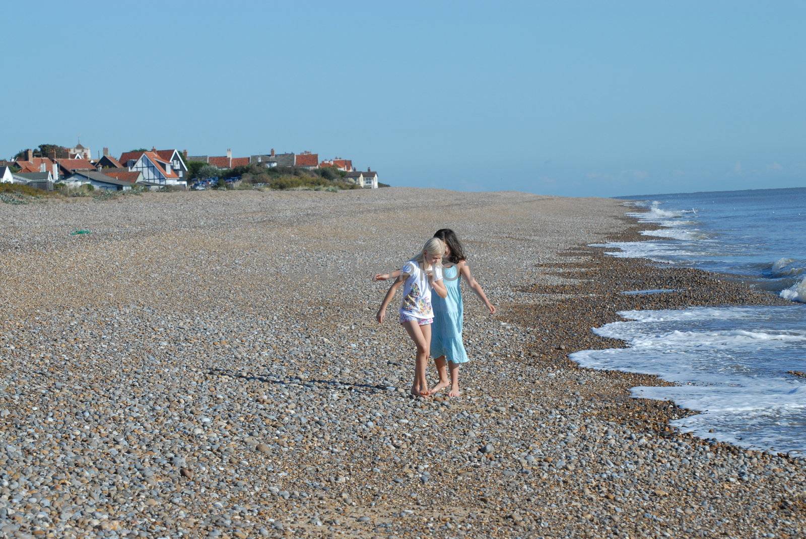 Please note: No negative use allowed







Girls playing on the beach Suffolk, England