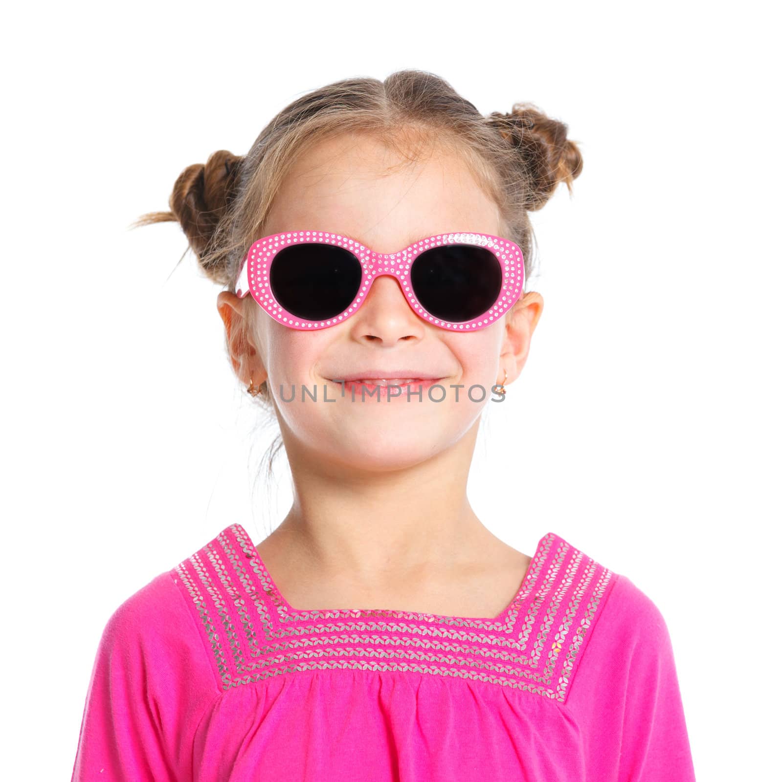 Portrait of little fashion girl in pink dress and sunglasses. Isolated white backround.