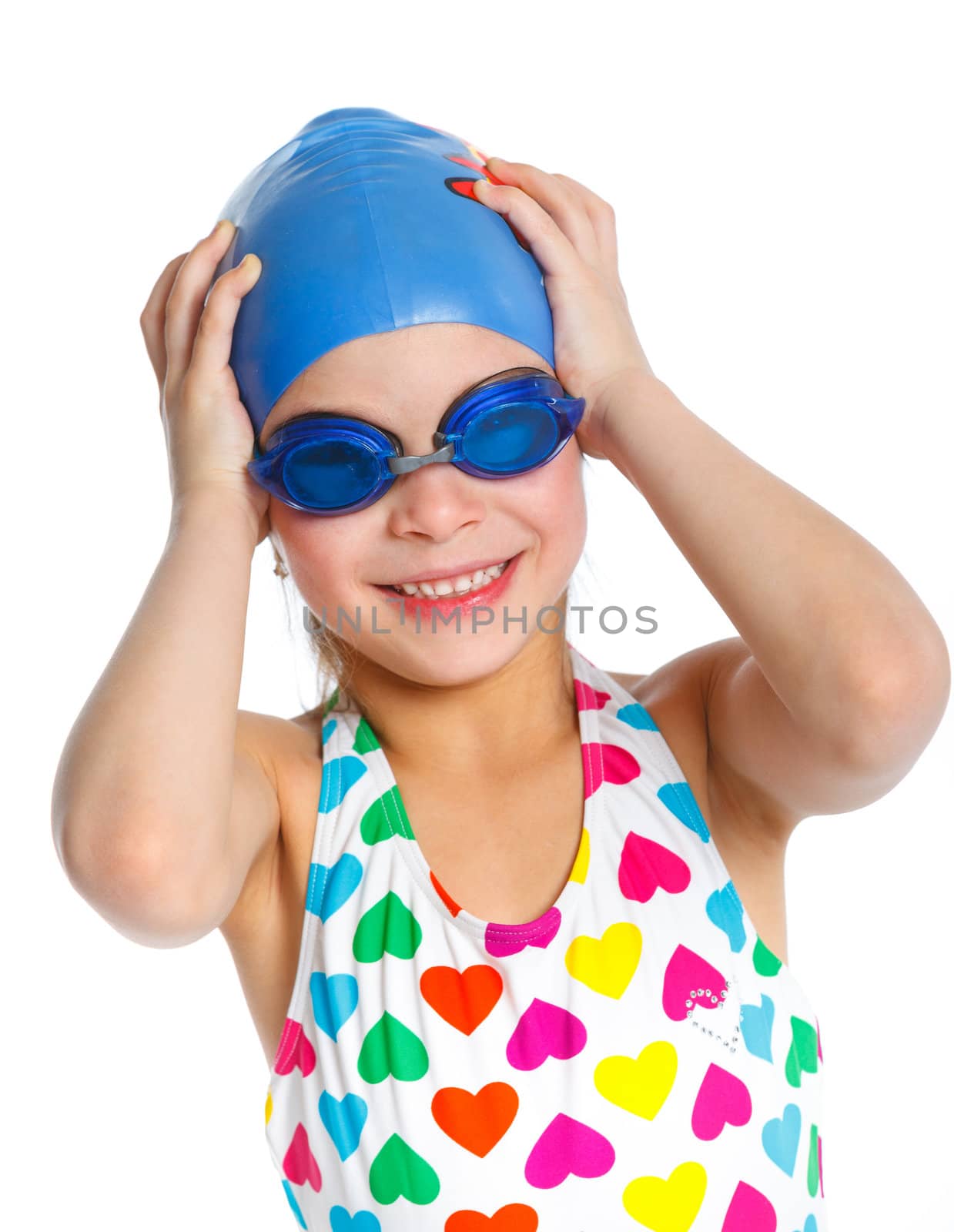 Young girl in swimsuit and swimming goggles over white background