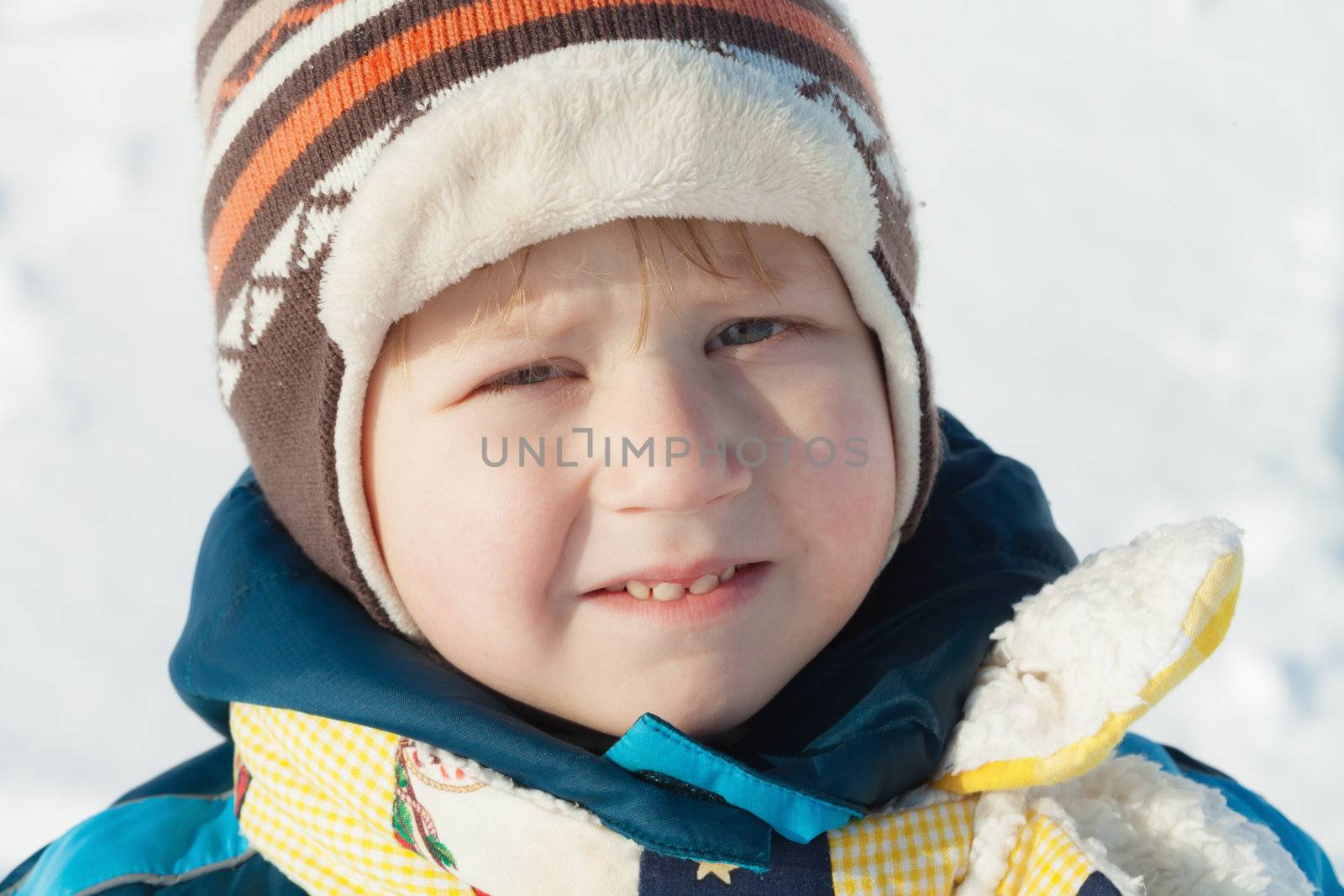 Portrait of boy in winter cloths outdoors by MikLav