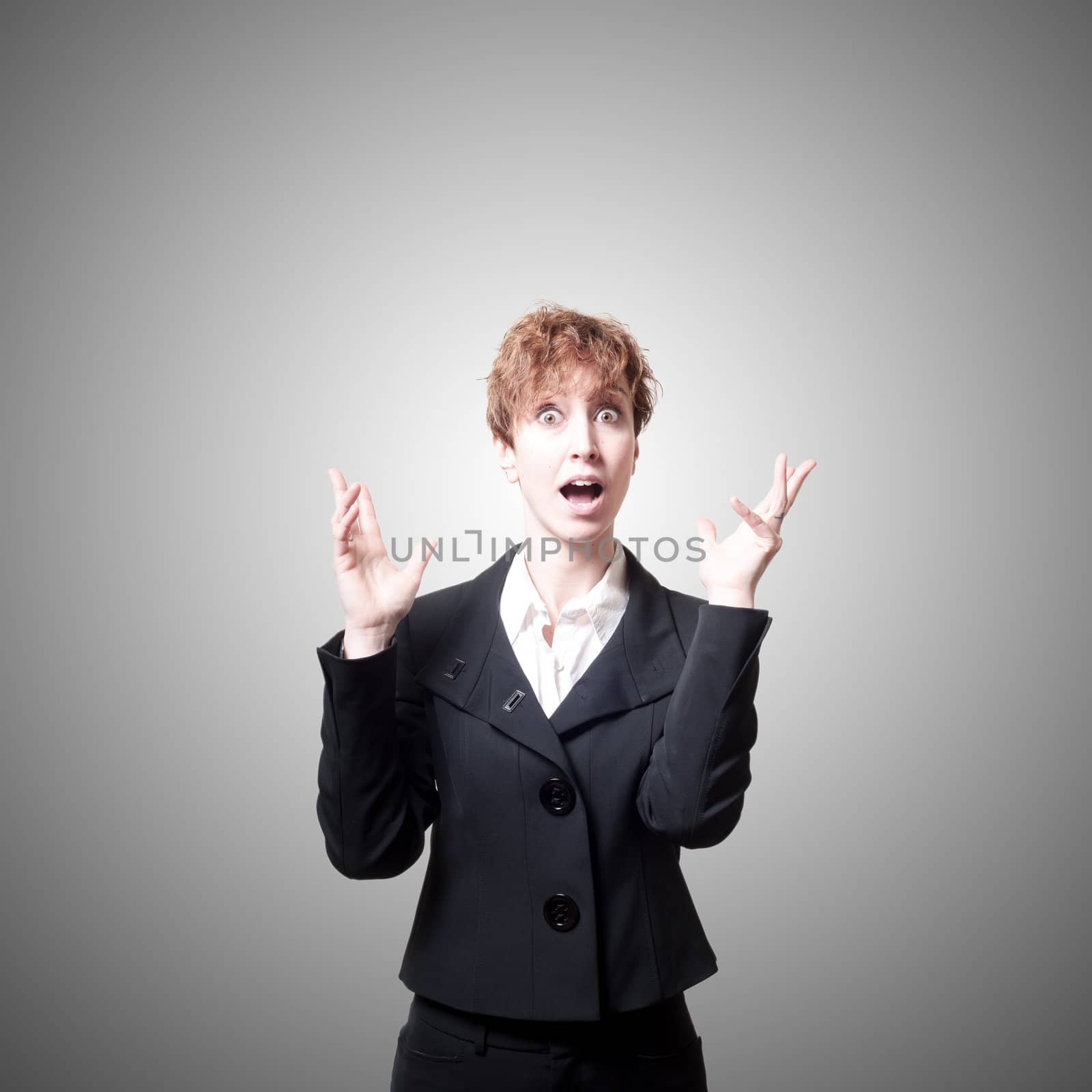 surprised success short hair business woman on gray background