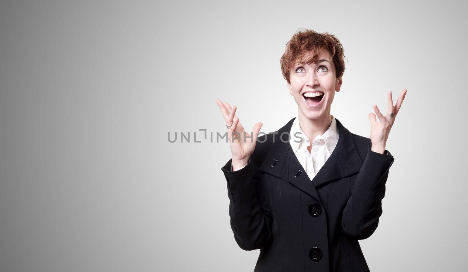 screaming success short hair business woman on gray background