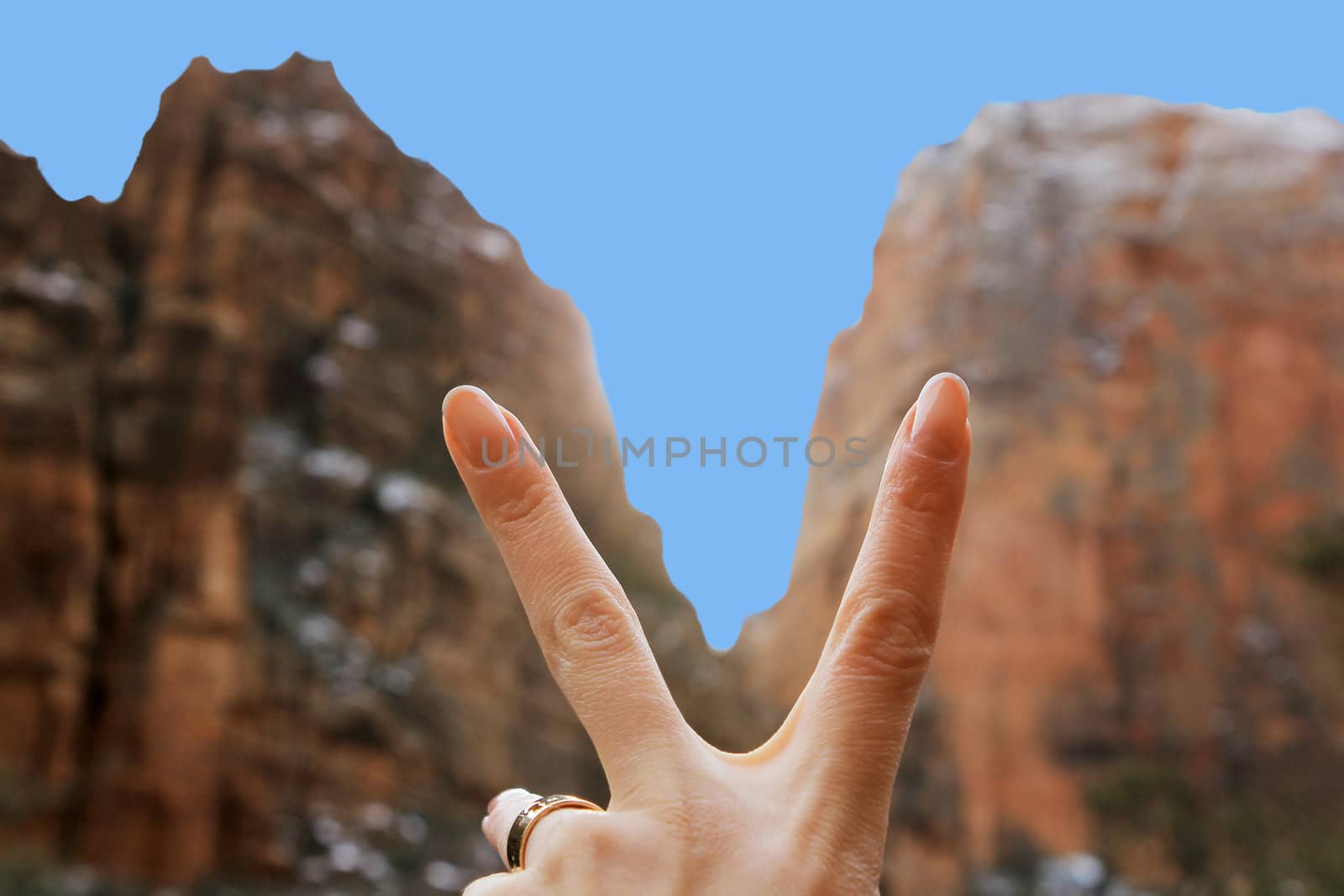 Female hand on a background the Zion national park in Utah on winter