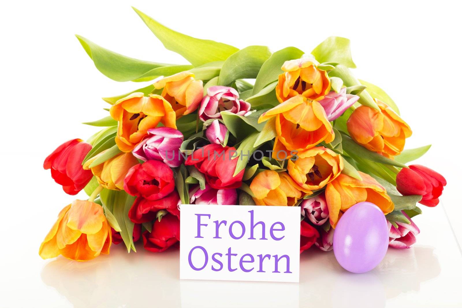 Bunch of tulips with easter egg and card: happy easter