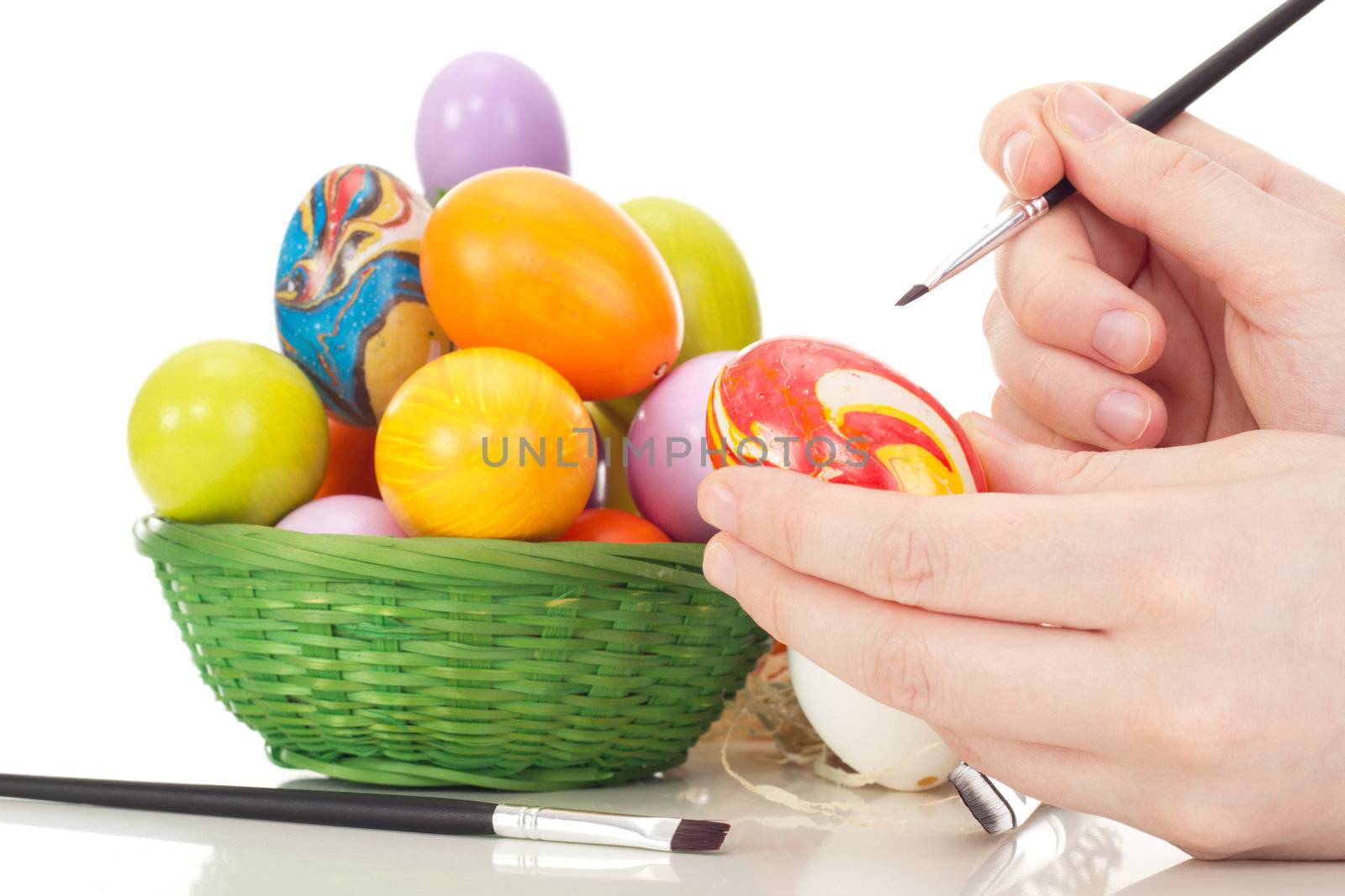 Person painting Easter eggs