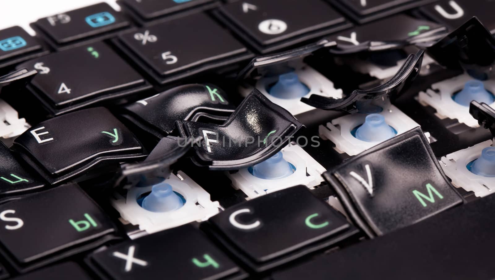Black laptop keyboard with distorted keys on it