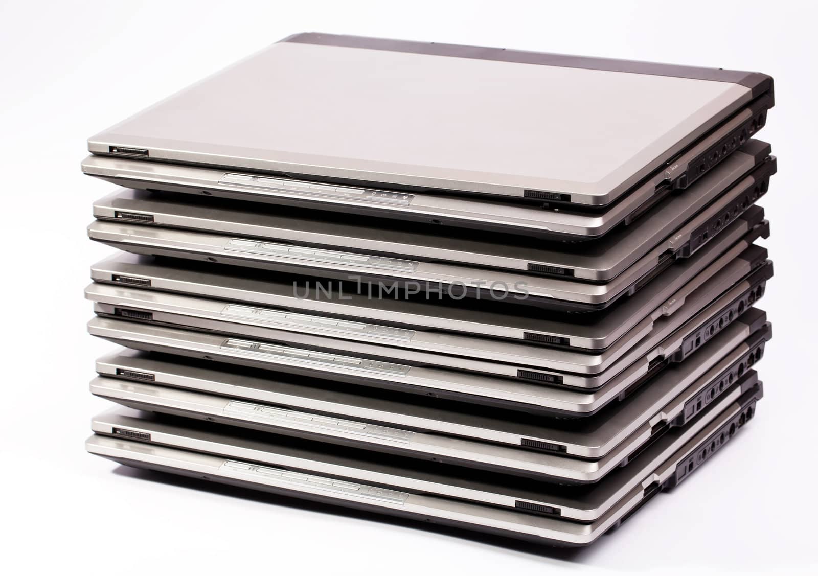 Pile of laptops on the white background