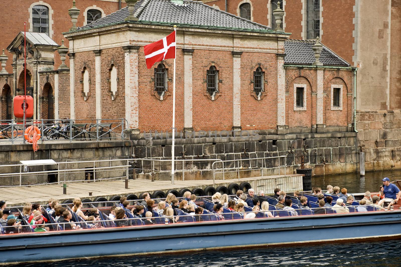 Group of tourists on an excursion boat in Copenhagen. Taken on June 2012