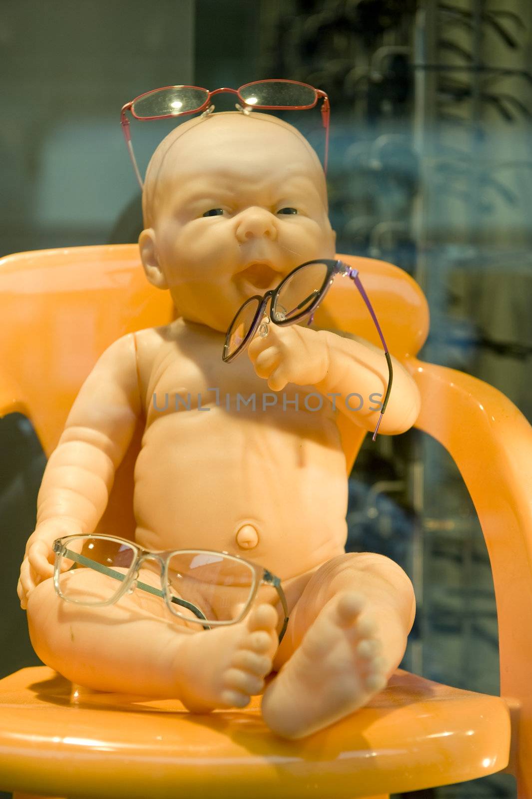 Naked doll in a glasses shop show-window. Taken in Copenhagen, Denmark on June 2012 