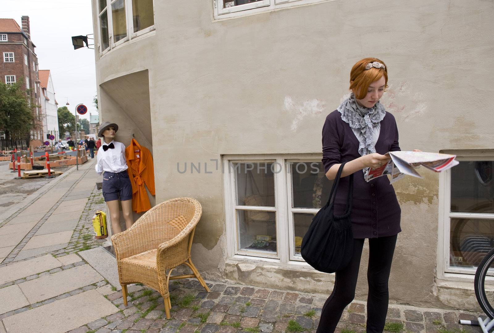 The young lonely woman on the street in the center of Copenhagen Denmark. Taken on June 2012