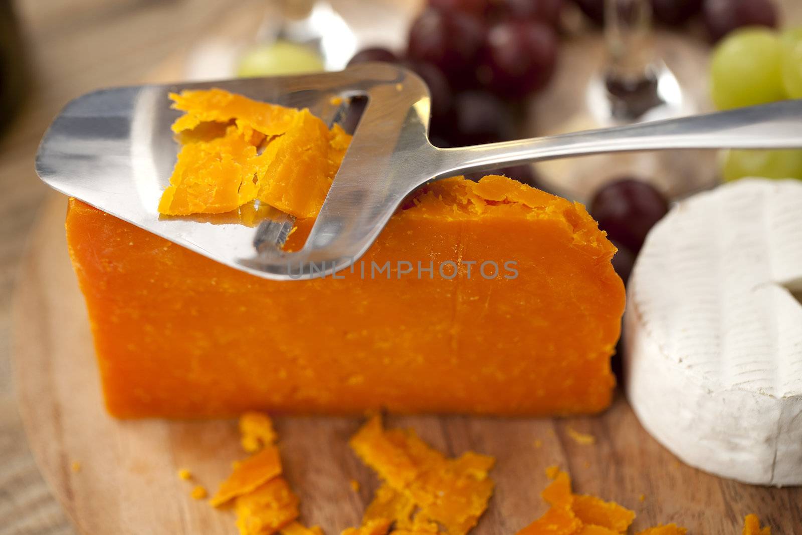 Orange Cheddar and feta cheese in a close-up image