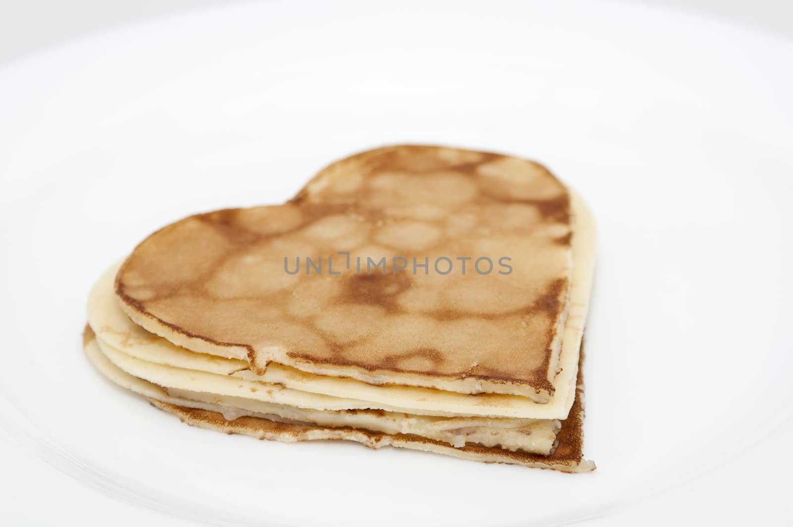 heart-shaped pancakes on white by dred