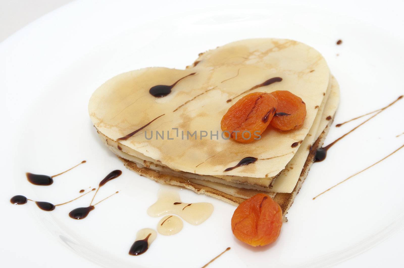 heart-shaped pancake on white by dred