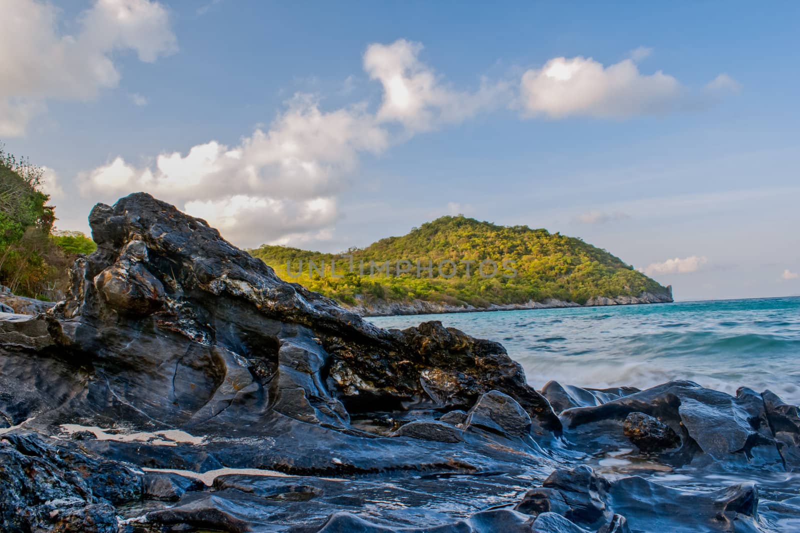 rocks in the sea against beautiful sunset by wasan_gredpree