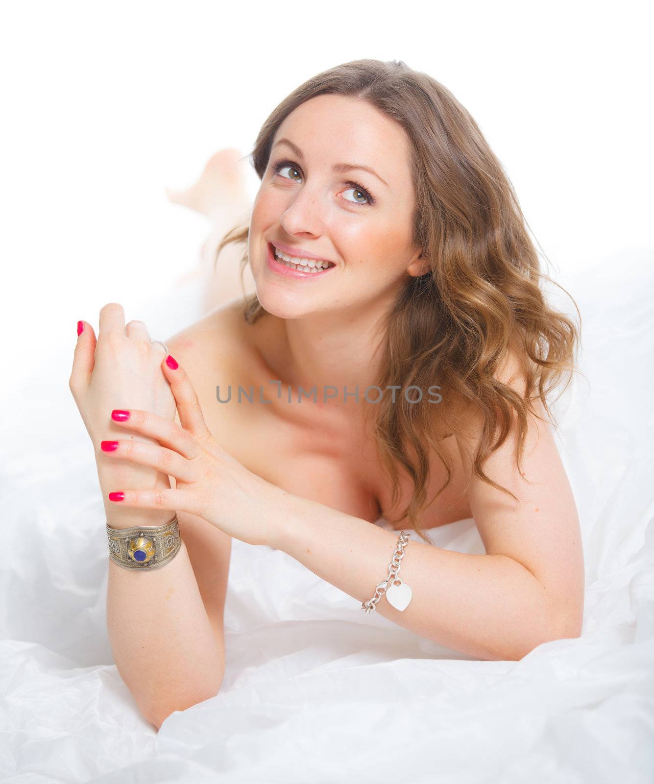 Portrait of beautiful young woman lying on the floor