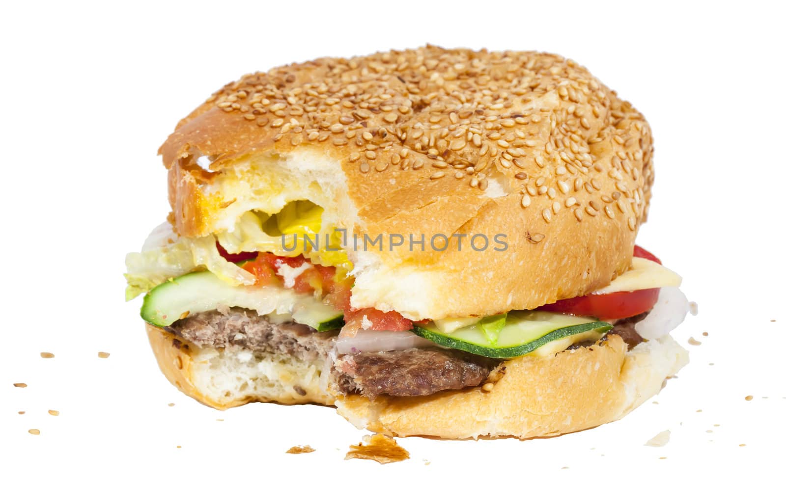 Bitten burger with crumbs isolated on white background