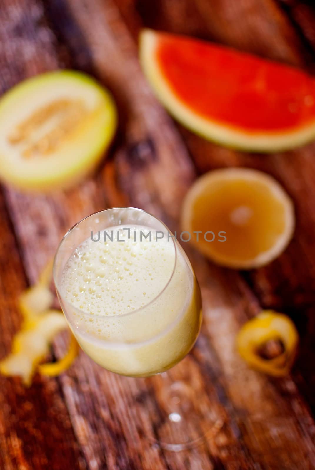 healthy juice made of freshly juiced fruits over wooden surface