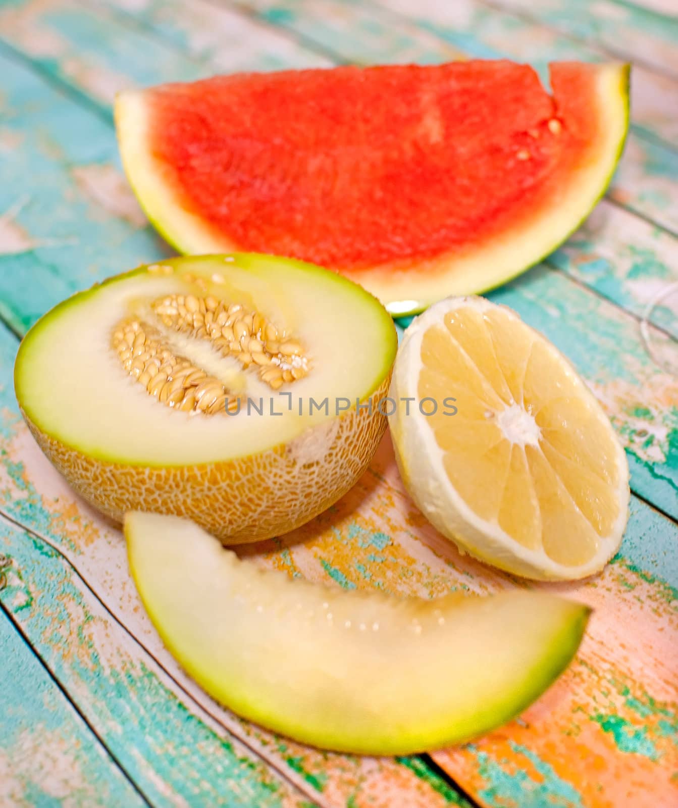 fresh organic slices of fruits over wooden boards