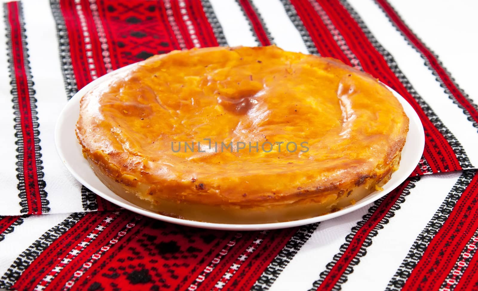 Onion and cheese pie on traditional ukrainian towel by RawGroup