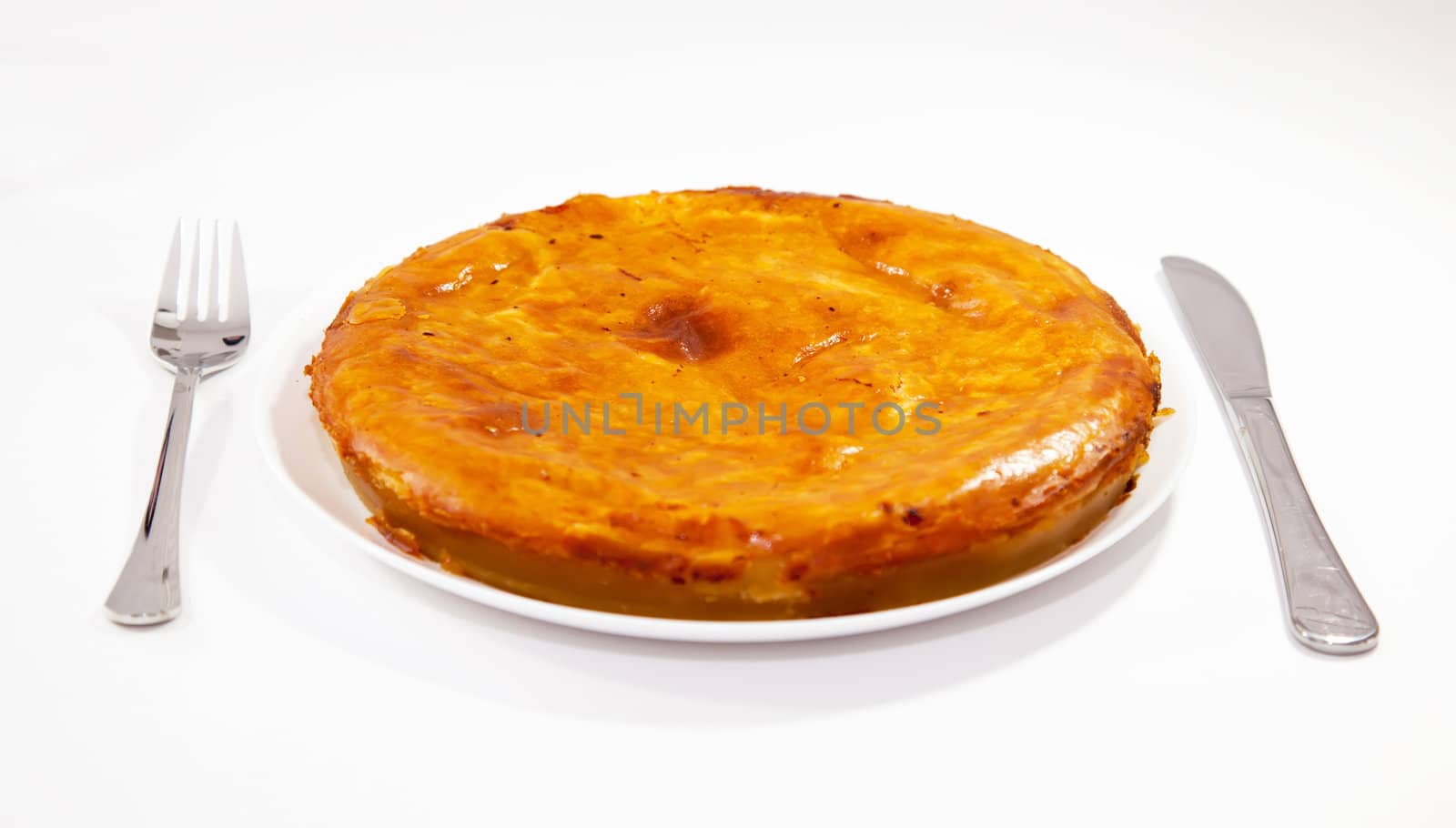 Onion and cheese pie with fork and knife