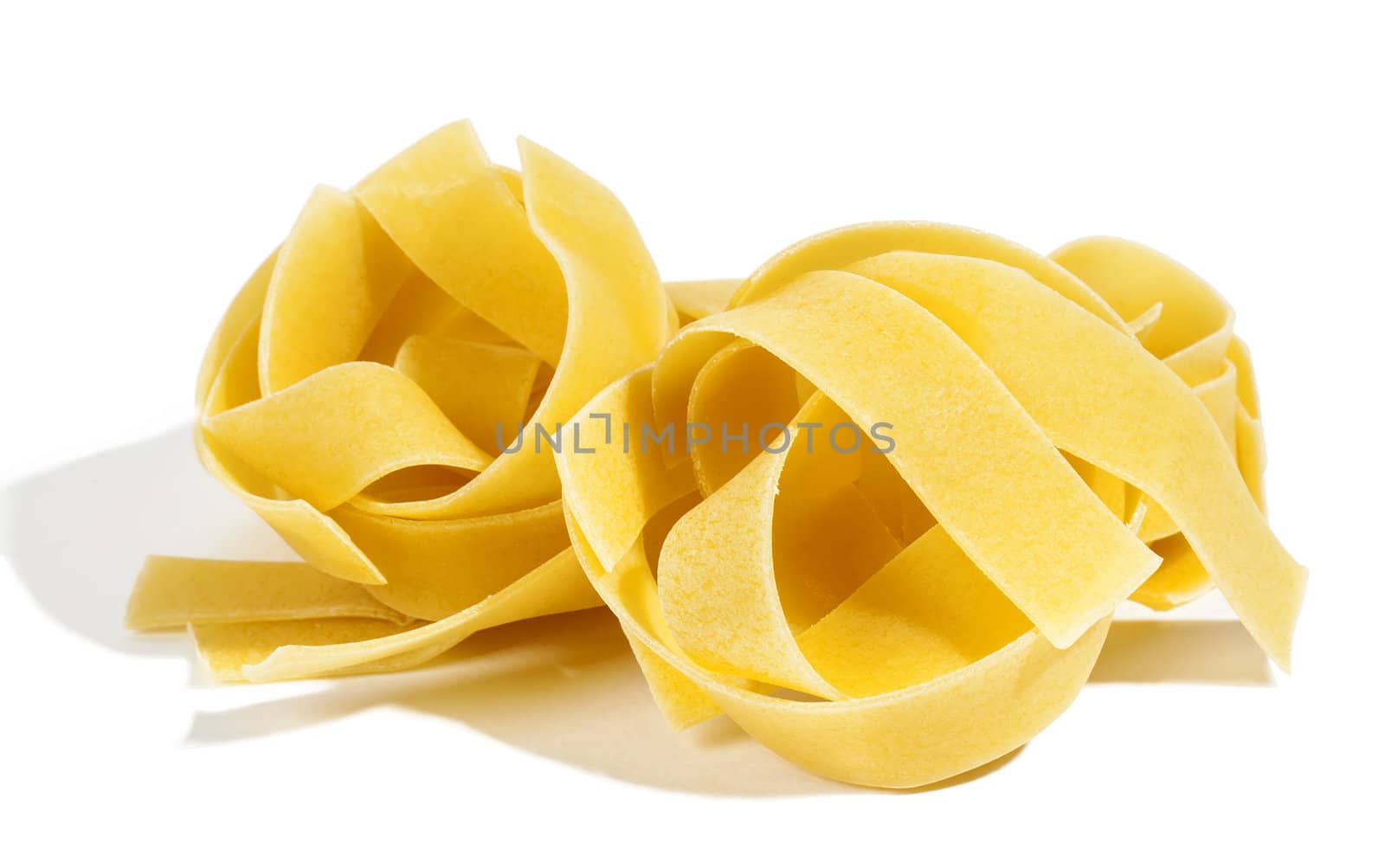 Raw pasta isolated on white background 