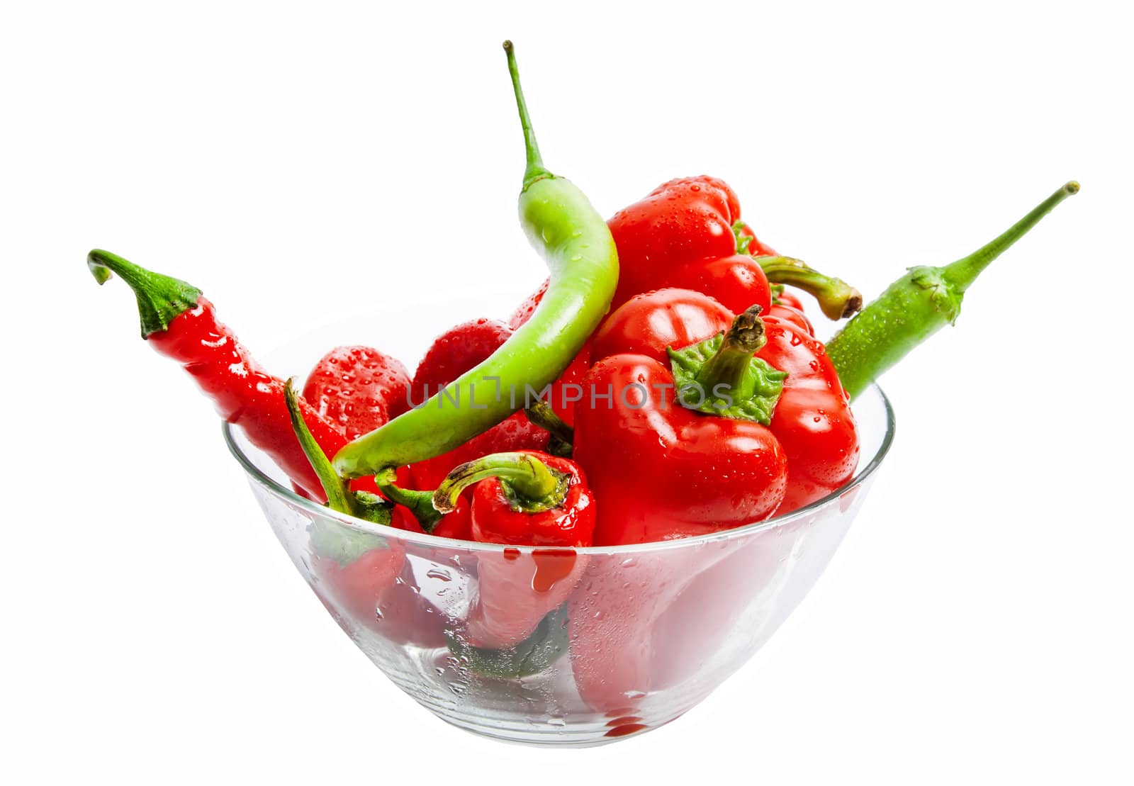 Red and green chili and bulgarian pepper in glass dish isolated on white