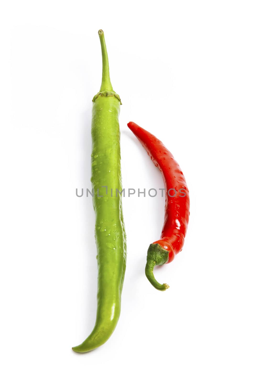 Red and green chili pepper composition isolated on white